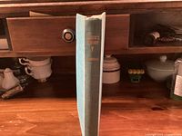 Spine view of blue cloth hardcover