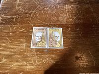 Front view of two attached 8¢ Canadian stamps showing portrait and tower