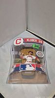 Front angled view of sealed Corey Kluber figure in packaging