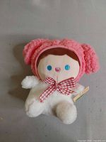 Front view of My Melody baby plush showing design details