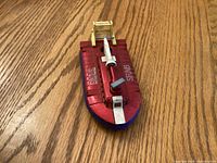 Top view showing red deck, white prop support, yellow cabin, lettering "SRN6"