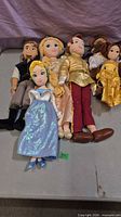 All six Disney plush dolls laid out on table
