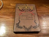Front cover of Aesop's Fables book showing ornate design and wear