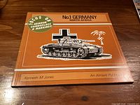 Front cover showing title, series, author and tank illustration