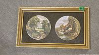Full view of framed display with two round plates