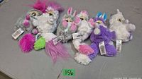 Six Fur Babies World plush animals side by side