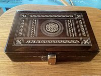 Top view showing carved lid design and latch