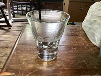 Glenfiddich etched glass tumbler on wooden surface