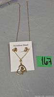 Front view of necklace and earrings on card