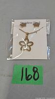 Front view of necklace and earrings on display card