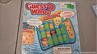 Front of worn Guess Who? box showing game image
