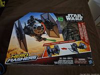 Front of Star Wars Hero Mashers TIE Fighter box displaying vehicle and figure
