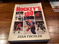 Front cover showing title, author, and player photos