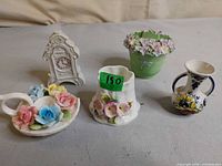 Group shot of all five miniature porcelain pieces