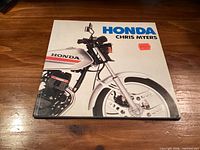 Front cover of Honda book showing title, author, motorcycle image