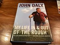 Front cover of John Daly autobiography with dust jacket
