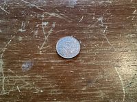 Reverse of 1935 Canadian 5-cent coin showing denomination and date