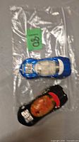 Both Hot Wheels cars inside clear bag