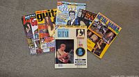All six magazines fanned out showing titles and covers
