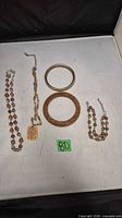 Overview of all five jewelry pieces laid out