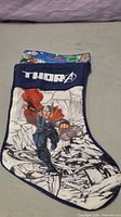 Front view showing Thor graphic, cuff embroidery