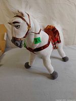 Full view of Disney Store Maximus plush standing