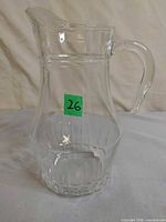 Front view of clear pressed glass milk pitcher