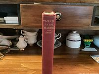 Spine of red cloth hardcover showing title and author