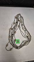 Full view of necklace showing multi strands and overall design