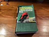 Front cover displaying title, edition note, and bird image