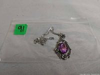 Necklace in plastic bag showing chain and pendant