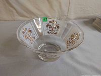 Full view of glass chip bowl showing flared shape and painted design