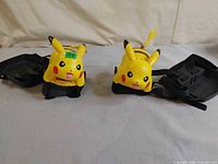 Both Pikachu disc launchers front view showing overall condition