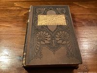 Front cover showing decorative design and gilt title
