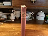 Spine view of red cloth hardcover book