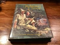 Front cover of Robinson Crusoe book with dust jacket