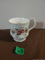 Mug front showing floral pattern and shape