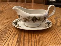 Gravy boat placed on underplate showing overall design