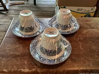 Three shrink-wrapped Royal Heritage cup and saucer sets
