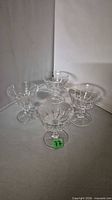 Four cut crystal coupes grouped, front item tagged 77