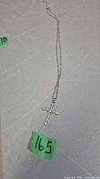 Full view of necklace laid flat showing chain length and pendant