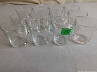 Front angled view of 12 clear tumblers