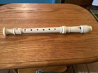 Full side view showing finger holes and overall condition
