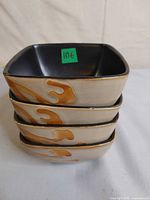 four stacked bowls showing exterior glaze and shape