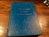 Front cover showing full title and author on blue cloth board