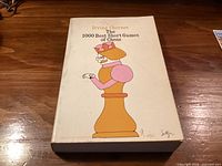 Front cover of softcover book showing title, author, and illustrative design