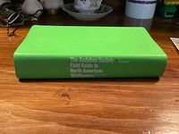 Green softcover book, spine visible with full title