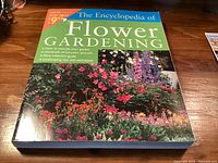 Front cover showing title, floral imagery, price sticker