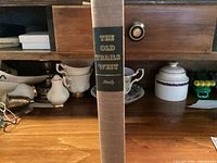 Spine view of The Old Trails West hardcover showing title, author, cloth texture