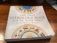 Front cover of the astrology book showing title, author and cover art